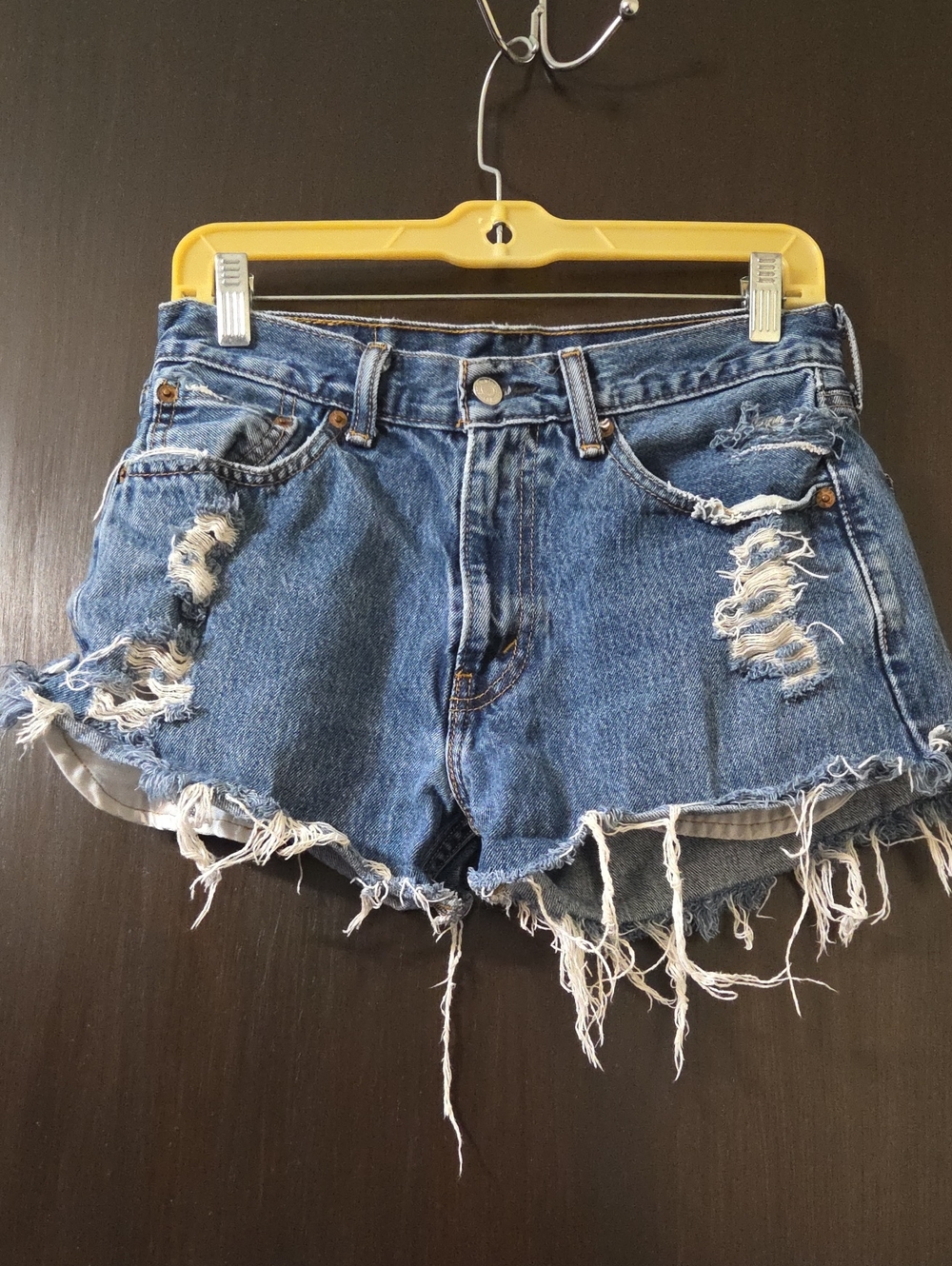 Levi's  Blue Denim cut off Shorts distressed.      15 in. waist    11 in. length